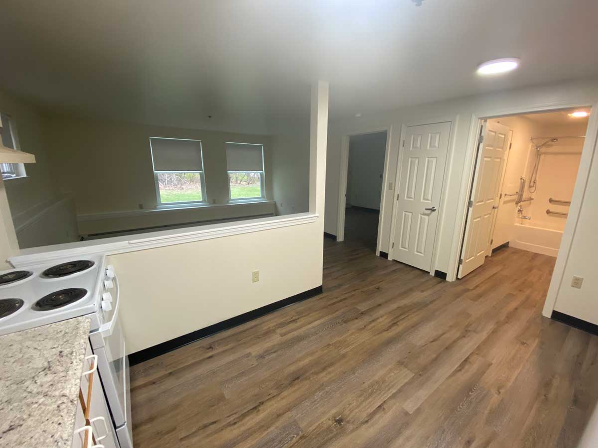 View of the living room, bathroom and bedroom from the kitchen