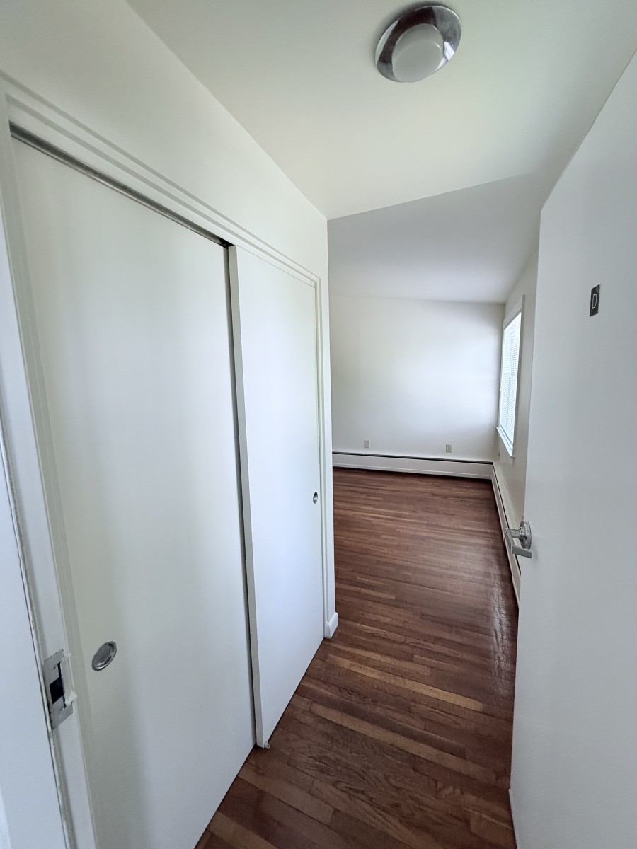 Coat closet and entry into apartment unit