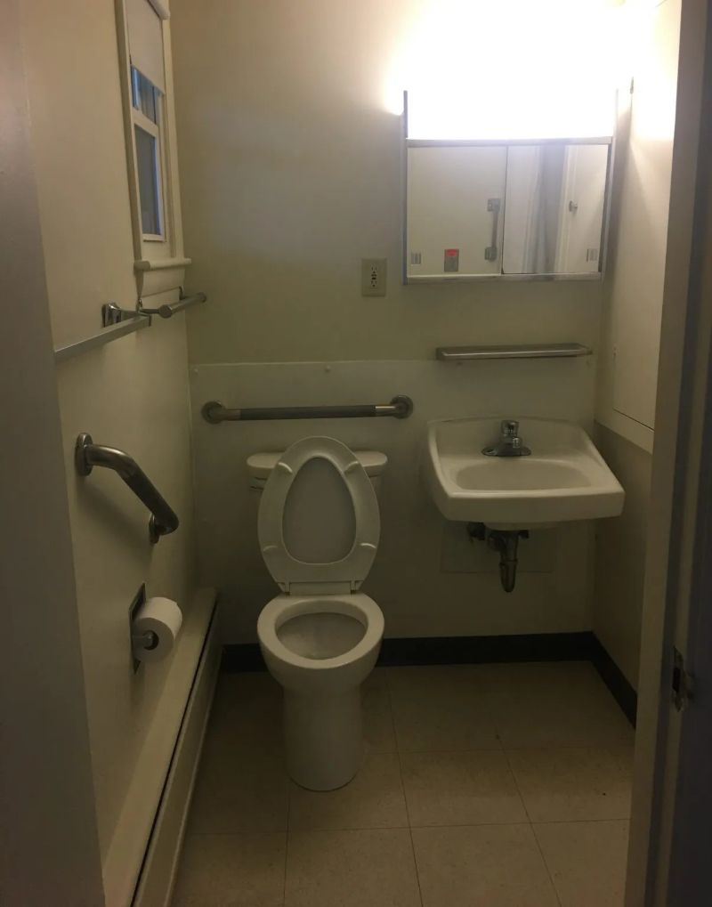 Toilet, sink, and mirror in the bathroom