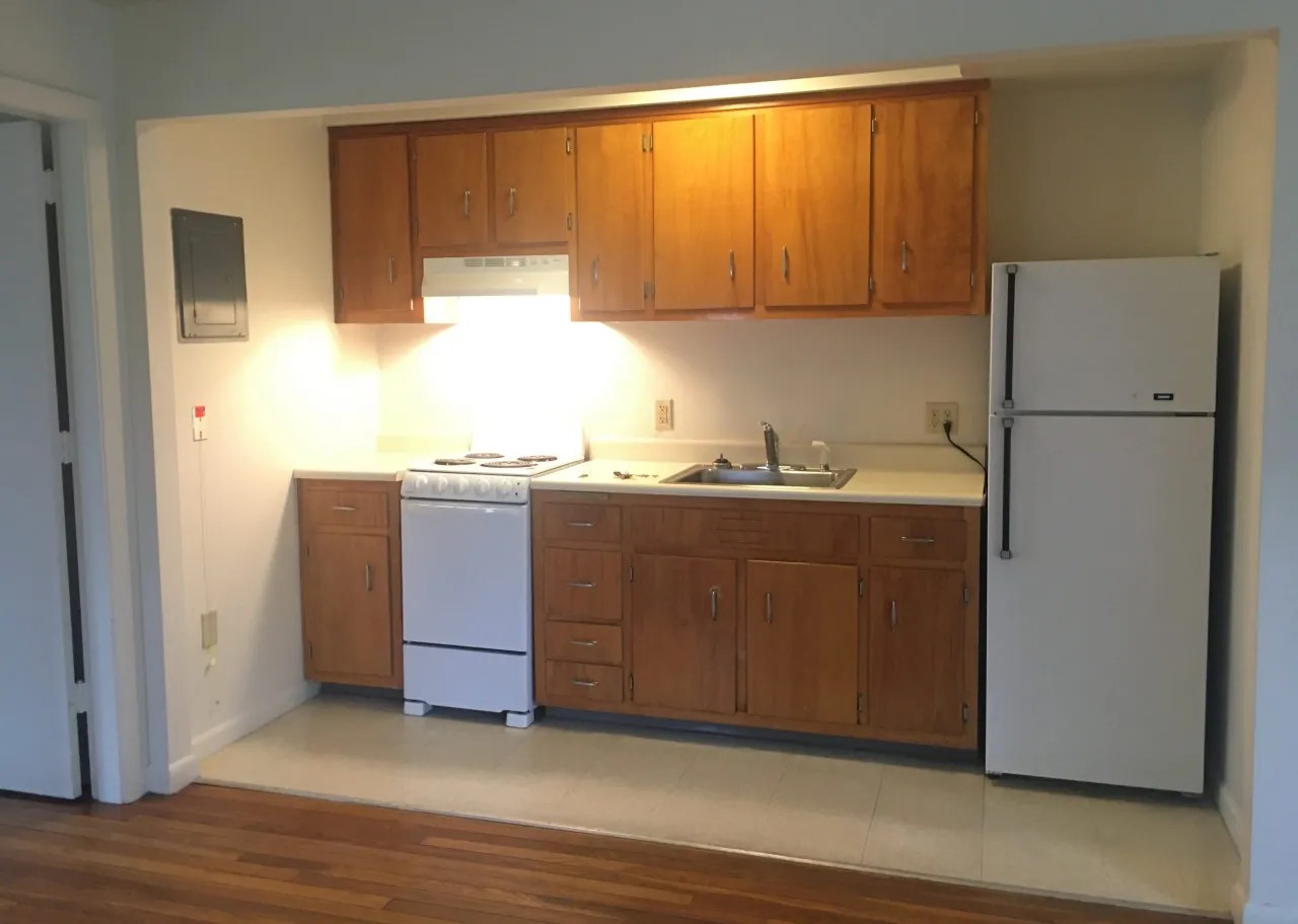 Kitchen with sink, stove and refridgerator
